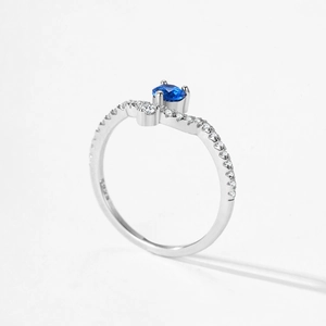 Vintage S925 sterling silver ring with sky blue zircon and wavy V-shaped band design
