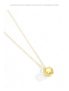 Detail showing luxurious rose-cut yellow citrine pendant on a gold S925 silver chain