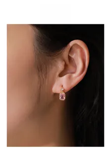 Close-up of S925 silver pink zircon square earrings worn by a model for detail
