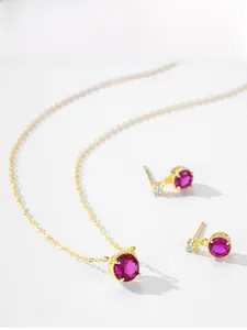 Detail view of gold-plated S925 silver jewelry set with rose red zircon stones