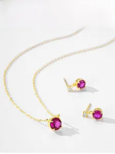 Detailed set of 14K gold plated necklace and red round zircon stud earrings