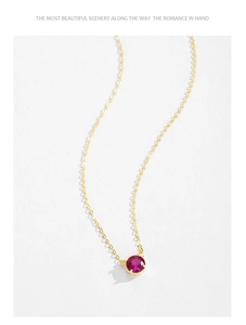 Detailed view of a round red zircon pendant on a gold-plated S925 silver chain