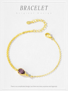 Detail of S925 sterling silver gold plated bracelet with pear-cut purple zircon