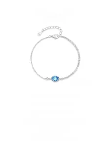 Detail of S925 sterling silver bracelet with oval blue zircon and elegant double chain