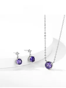 Detailed view of S925 silver jewelry set with purple zircon pendant and drop earrings