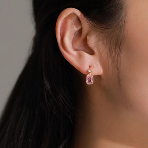 Luxurious S925 silver stud earrings featuring square pink zircon stones on earlobe