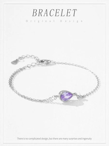 Detailed macro view of S925 sterling silver bracelet featuring a purple drop zircon