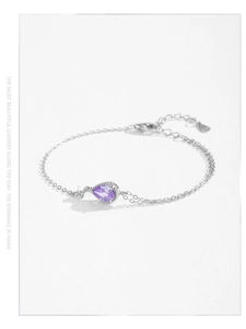 Detail of S925 sterling silver stamp on clasp with pear-shaped purple zircon bracelet