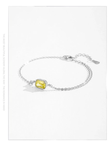 Detail of S925 sterling silver double-layer bracelet with yellow zircon and lobster clasp