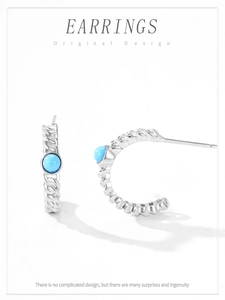 Detail of S925 silver turquoise stud earrings with twisted rope texture design