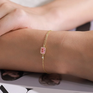 Elegant gold S925 silver bracelet featuring a pink rectangular gemstone and zircon