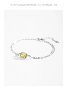 Macro shot of S925 silver bracelet featuring a yellow rectangular zircon and lobster clasp