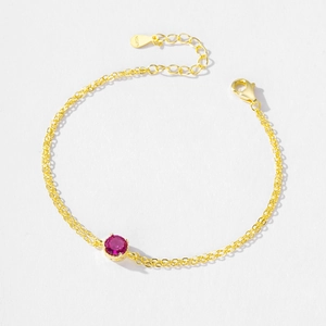 S925 sterling silver gold plated bracelet with a round red zircon and lobster clasp