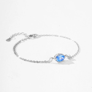 S925 sterling silver bracelet featuring an oval blue zircon and lobster clasp closure