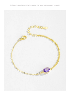 Macro detail of S925 sterling silver stamp on golden chain with purple crystal