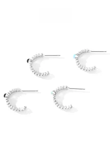 Detailed view of S925 sterling silver C-shaped twisted earrings with black and blue beads