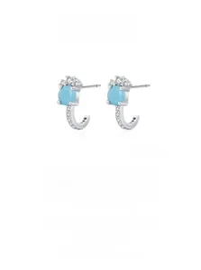 Detail of J-shaped S925 silver stud earrings with blue turquoise and white zircons
