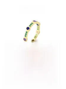 Detailed macro shot of 925 silver ring featuring colorful zircon stones in gold finish