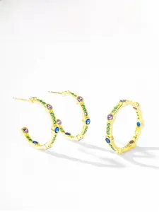 Close-up of gold plated S925 silver C-shape earrings with colorful bezel-set stones