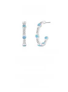 Detail of 925 sterling silver C-shaped earrings with turquoise and zircon stones