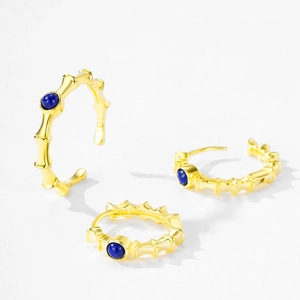 Gold bamboo texture hoop earrings set with round blue lapis stone in 925 silver