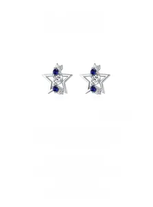 Detailed macro of S925 silver star studs with blue gems and white zircon inlay