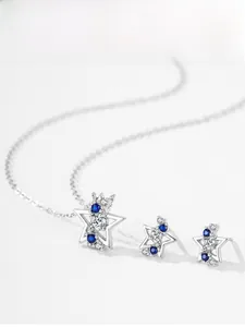 Detailed view of 925 silver star jewelry set with sparkling blue and white zircon stones