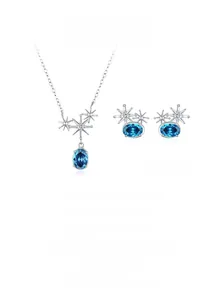 Detailed view of 925 silver starburst necklace and earrings with blue oval gemstones