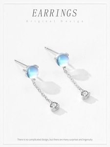 Detail of S925 silver moonstone earrings with tassel chain and tiny cubic zirconia