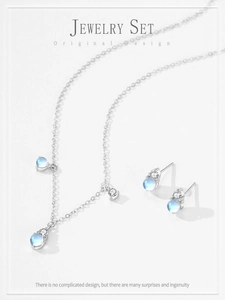 Détails du coffret bijoux en argent S925 avec pierres de lune et pompons en zircone