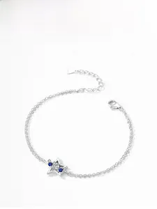 Detail of 925 sterling silver star bracelet with blue and white zircon stones
