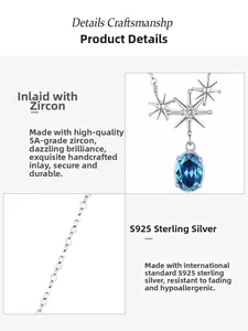 Detail showing 925 sterling silver star pendant with oval blue zircon and O-shaped chain