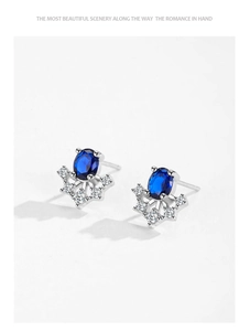 Detailed side view of S925 sterling silver sapphire stud earrings with crown-set cubic zirconia