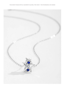 Detail of S925 silver star pendant necklace with blue and white zircon inlay