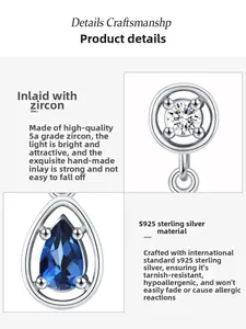 Macro view of S925 sterling silver drop earring with sapphire blue stone and 5A zircon