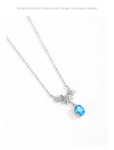 Detailed close-up of 925 silver star pendant necklace with sea blue zircon stone