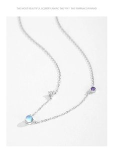 Macro detail of S925 silver necklace featuring iridescent moonstone and purple gemstone