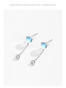 Detail of S925 silver stud earrings featuring moonstone beads and dangling zircon chains