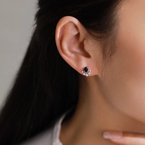 Vintage S925 sterling silver sapphire stud earrings with white diamond accents on model