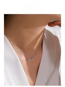 Elegant S925 silver necklace with three-stone moonstone pendant on female model