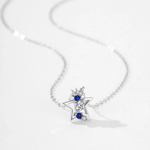 S925 sterling silver necklace with star pendant and blue crystal stones on white base