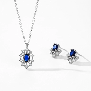 S925 sterling silver jewelry set featuring oval blue sapphire pendants and sparkly diamonds