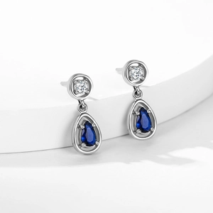 Vintage S925 silver earrings with teardrop sapphire pendant and sparkling crystal details