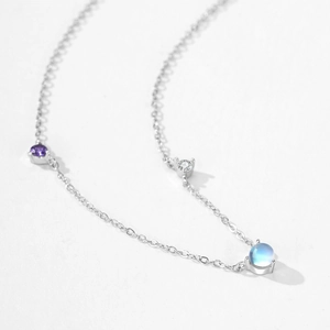 S925 sterling silver necklace featuring purple gemstone and blue moonstone pendant