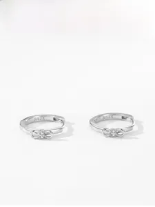 Close-up of S925 sterling silver bow earrings with micro-set zircon stones