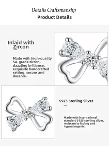 Macro shot of S925 sterling silver bow knot heart earrings with sparkling 5A cubic zirconia