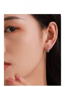 Close-up of elegant S925 silver double-layer Mobius earrings with sparkling zircons