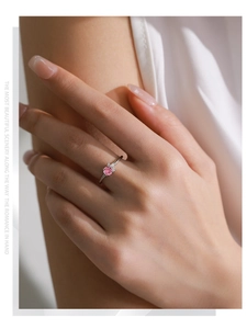 On-hand view of S925 silver ring featuring a pink zircon center stone and side accents