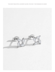 Detail view of S925 sterling silver windmill stud earrings with marquise cubic zirconia