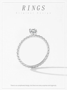 Detailed close-up of a S925 sterling silver beaded ring with a brilliant round diamond